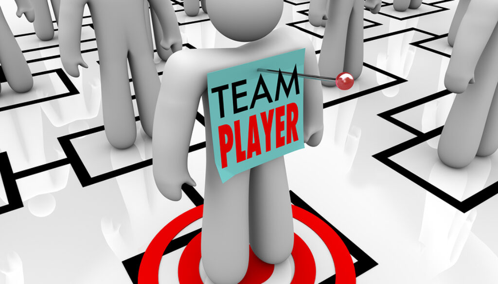 bigstock-a-worker-marked-team-player-is-24835310