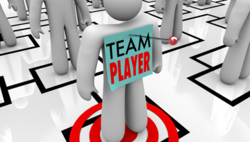 bigstock-a-worker-marked-team-player-is-24835310